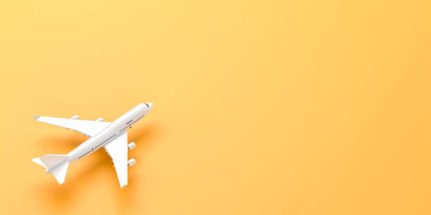 istock White airplane isolated on yellow background. 3D illustration. 1178756277