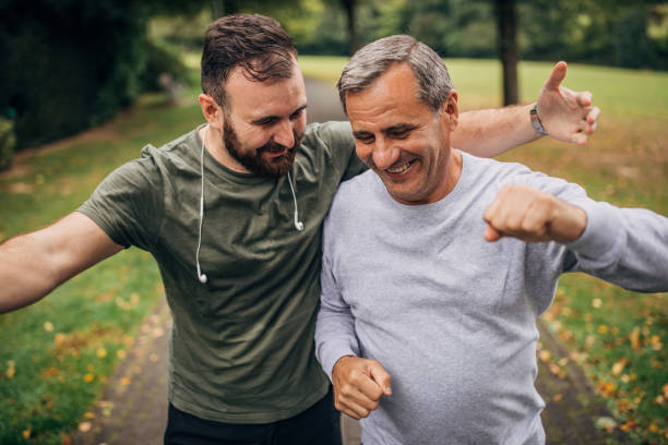 istock Father and son jogging in park 1178761583