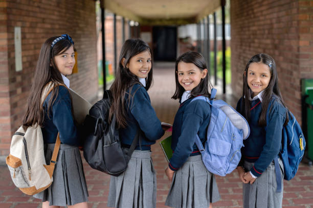 istock Happy group female students at school 1178762694