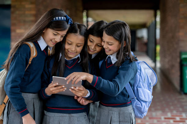 istock Girls studying on a tablet computer at the school 1178762726