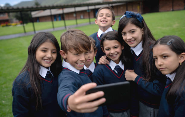 istock Group of kids taking a selfie at the school 1178762734