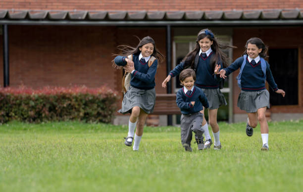 istock Happy group of kids playing outdoors at the school 1178762737