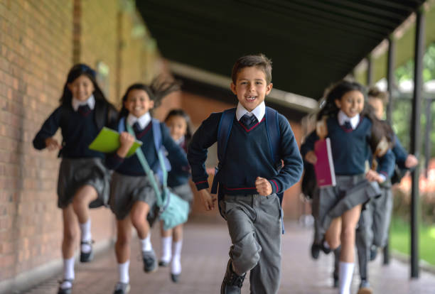 istock Group of students running to their class 1178762744