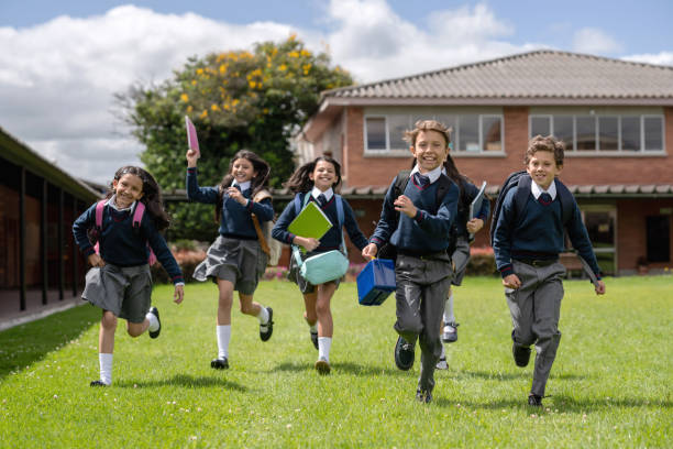 istock Happy students running to class at the school 1178762757