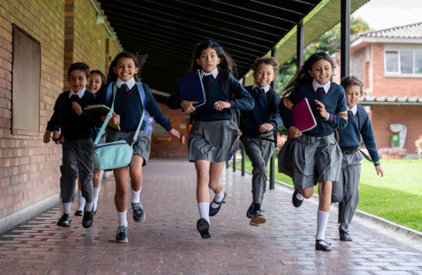 istock Students running towards the classroom at the school 1178762764