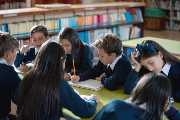 istock Group of kids studying in class at the school 1178762863