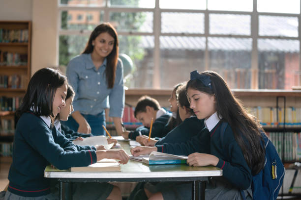 istock Group of kids in class at the school taking notes 1178762879