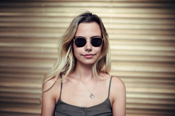 Cropped shot of an attractive young woman posing outside