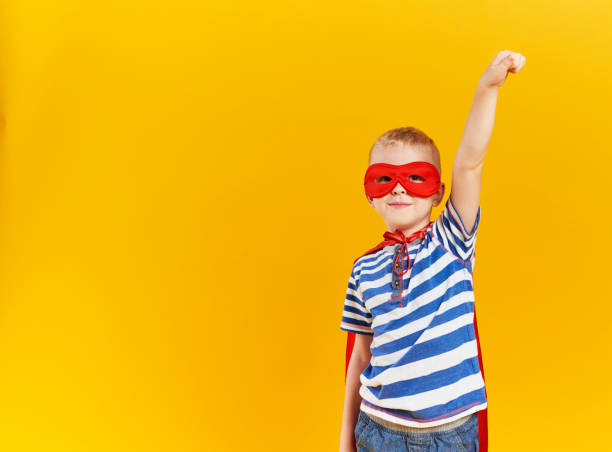 istock Front view of boy wearing a superhero costume 1178763362