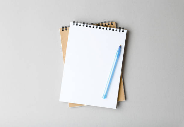 istock top view of a open notebook with pen on a gray background 1178763385