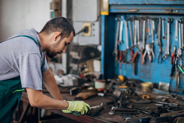 istock Young man working in metal factory 1178763433