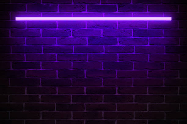 istock Background texture of empty red brick wall with vilet       neon light lamp, 80s style glow 1178764154