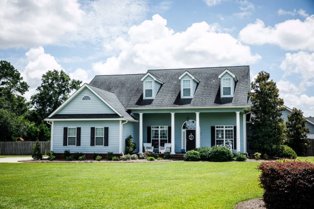 istock Front View of blue house with siding in the suburbs 1178764865