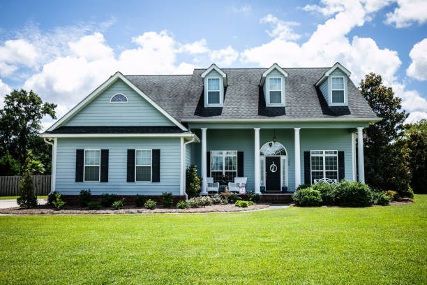 istock Front View of blue house with siding in the suburbs 1178764888