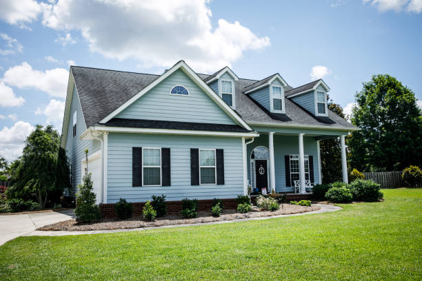 istock Front View of blue house with siding in the suburbs 1178764896