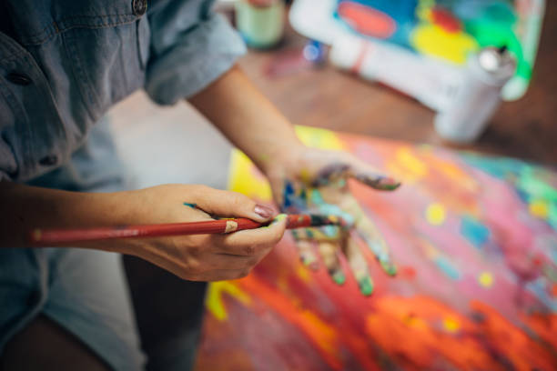 istock Creative woman painting in her studio 1178764944