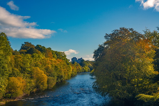 Fall Colors on the Banks of the River Teith in Scotland With Doune Castle in the Background on a Sunny Day in Autumn