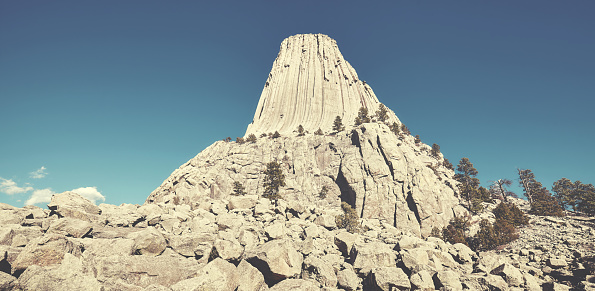 Retro stylized picture of the Devils Tower, top attraction in Wyoming State, USA.