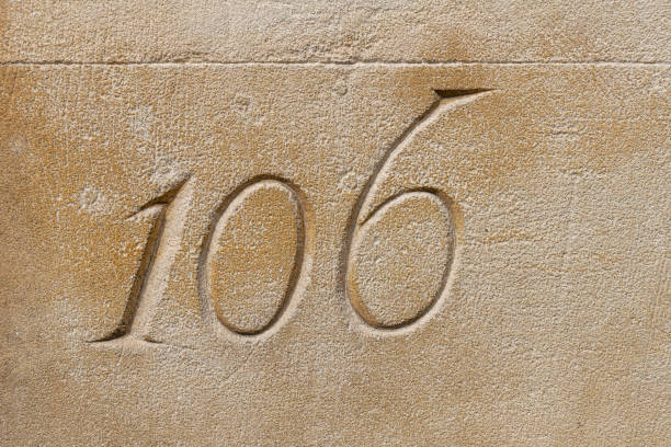 istock Number 106 carved in a limestone ashlar wall 1178767492