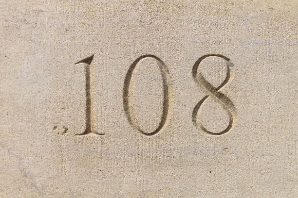 istock Number 108 carved in a limestone ashlar wall 1178767494