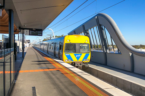 Melbourne, Australia; Oct 1, 2019: Victoria's Big Build: Melbourne CBD-bound Metro Train on SkyRail arrives at new elevated Murrumbeena Station. Comeng-built train has PTV logo on front