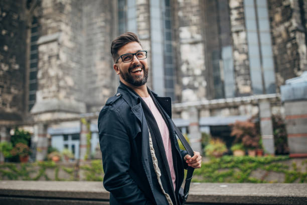 Handsome young man walking in the city