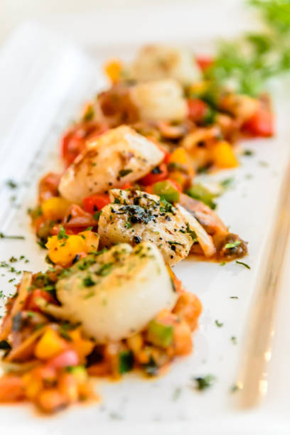 istock starter of seared scallops with tomato and zuchini salsa with herb and black pepper 1178772028