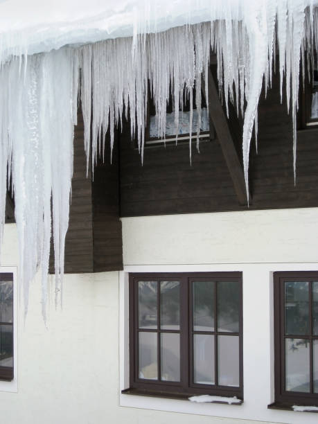 istock icicles in front of a house facade 117877281