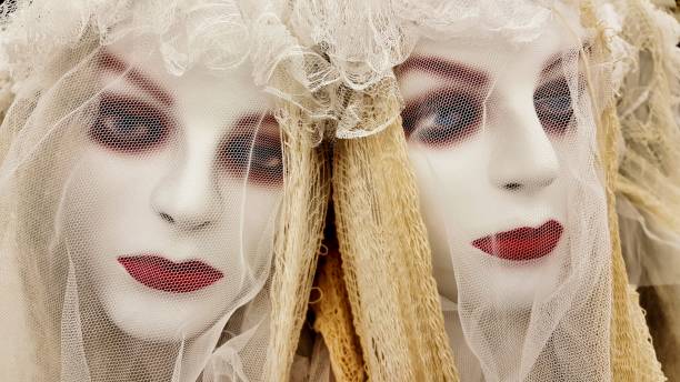 two ghoulish undead bride halloween decorations. - artists figure imagens e fotografias de stock