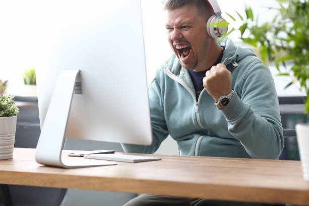 istock Man screaming in computer monitor sitting 1178773872