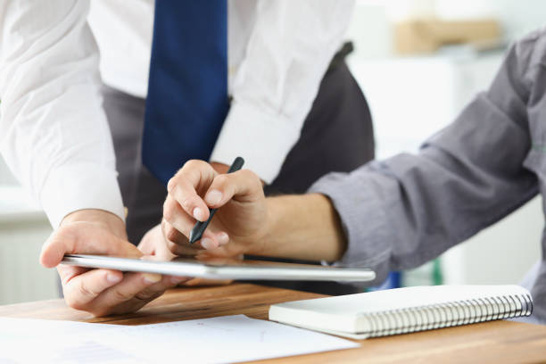 istock Two businessman are looking and studying statistics 1178774585