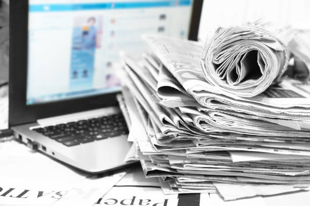 istock Newspapers and Laptop 1178774602