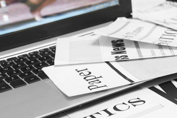 istock Newspapers and laptop 1178774927