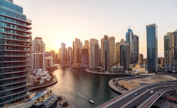 Aerial view of cityscape and skyscraper at sunset in Dubai Marina. stock photo