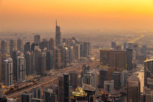 Aerial view of cityscape and skyscraper at sunset in Dubai Marina. stock photo