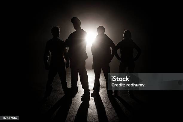 Gang In The Shadows Stock Photo - Download Image Now - Gang, In Silhouette, Group Of People