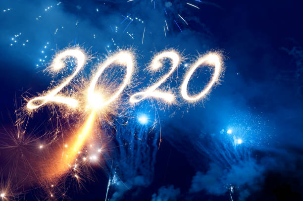 istock Sparkler Happy New Year 2020 With Fireworks 1178776069
