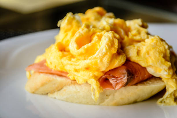 istock scrambled eggs on smoked salmon and baguette served on a white china plate 1178776961
