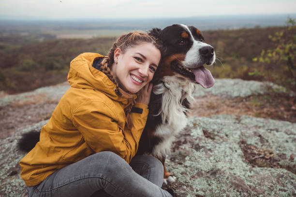 istock Young woman with dog 1178780196