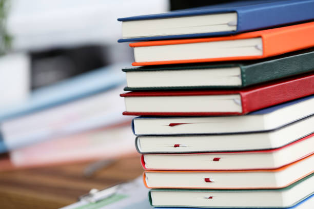 istock Lot of book li on the table against study room background 1178780558