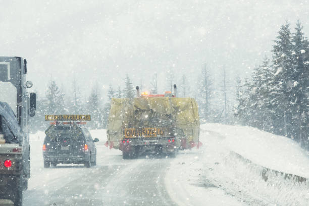 istock Oversize load transport on semi-truck over icy highway. 1178781270