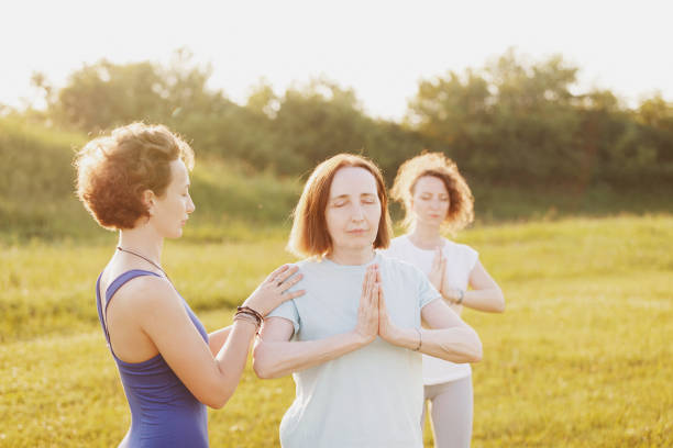 istock Mother and two young daughters do yoga 1178782668