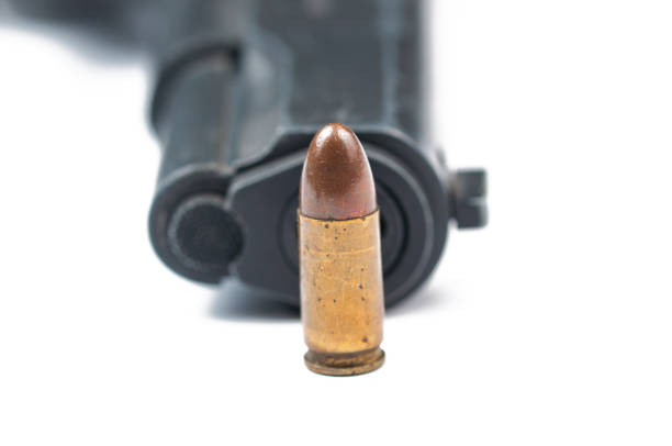 istock Gun and bullet isolated on white background.Copy space. 1178782787