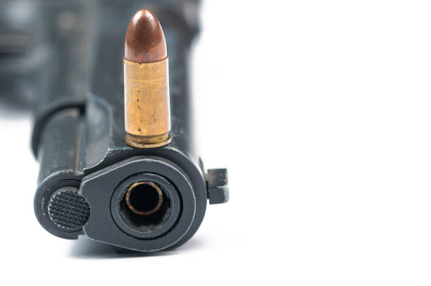 istock Gun and bullet isolated on white background.Copy space. 1178782807