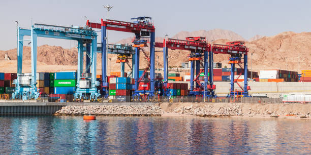 Rubber tyred gantry cranes in port Aqaba, Jordan - May 17, 2018: Rubber tyred gantry cranes work in Aqaba container terminal, Jordan gantry crane stock pictures, royalty-free photos & images