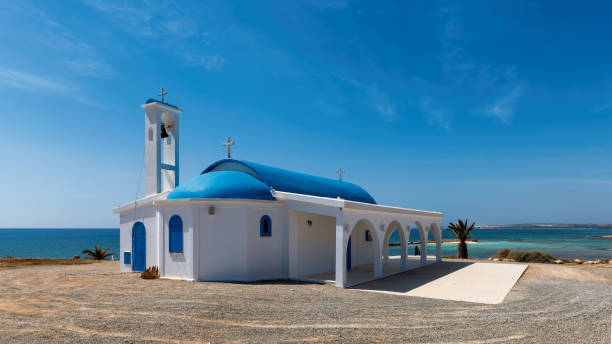 White and blue chapel on a beach near Aiya Napa, Cyprus.