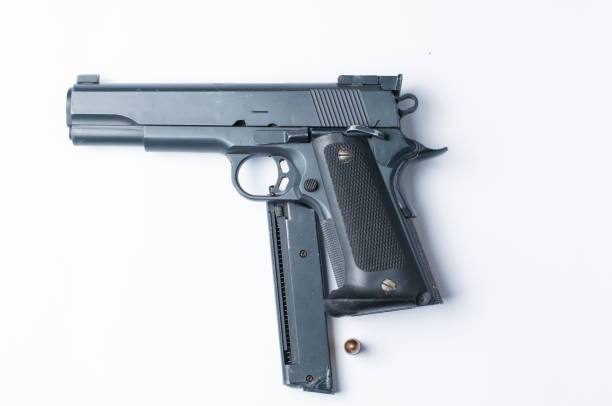 istock Gun and bullet isolated on white background.Copy space. 1178783012