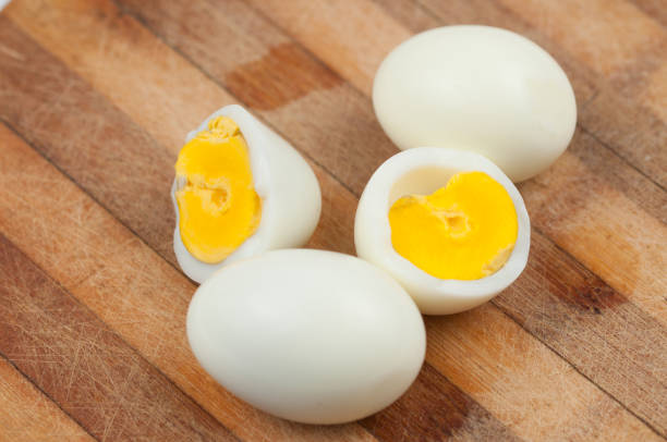 istock Egg on wooden board isolated on white background. 1178783083