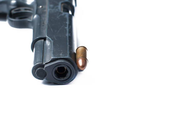 istock Gun and bullet isolated on white background.Copy space. 1178783099