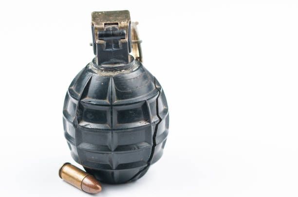 Hand grenade isolated on wooden background